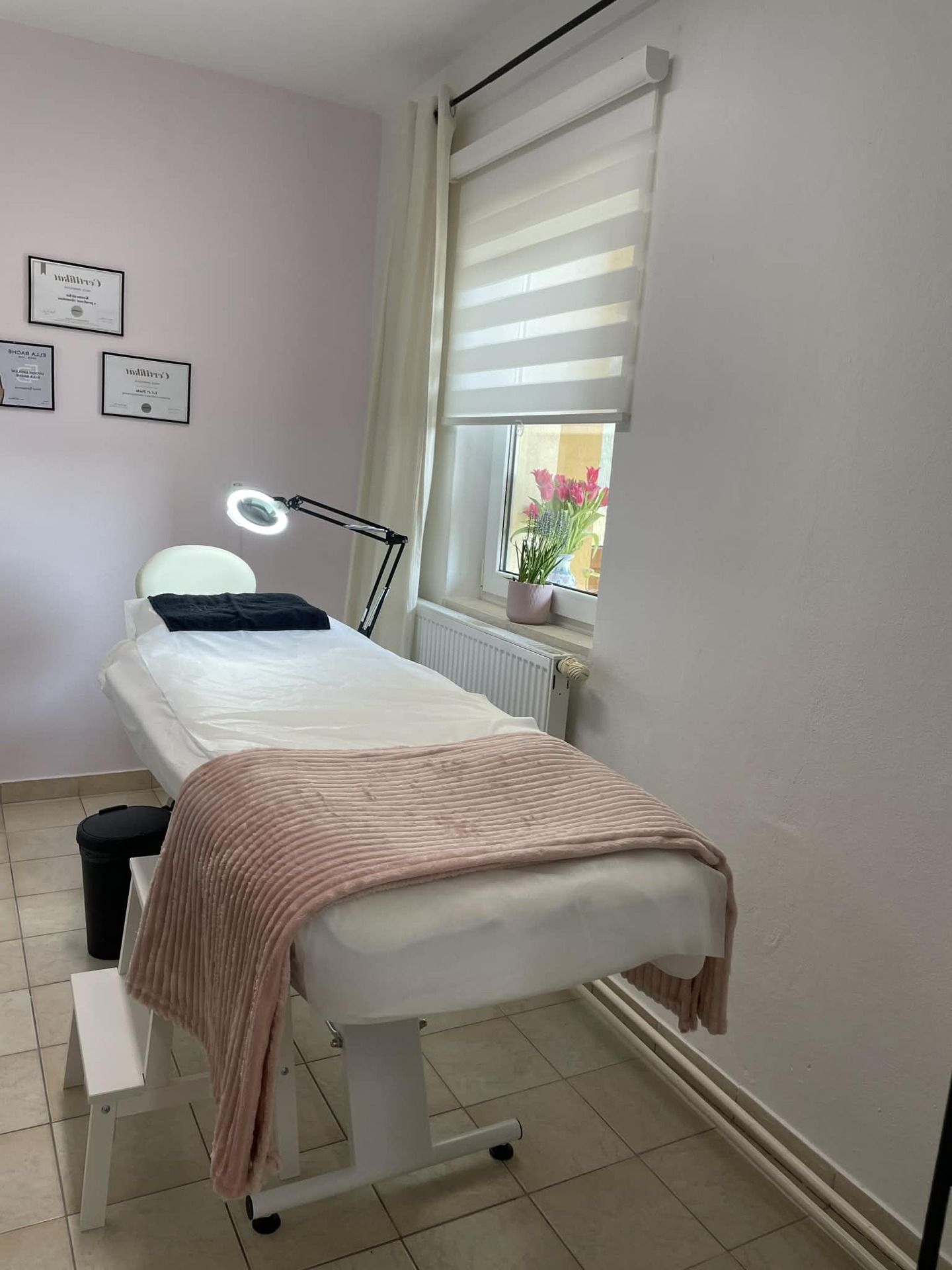 Treatment room at Nikol Beauty Studio — bed by the window